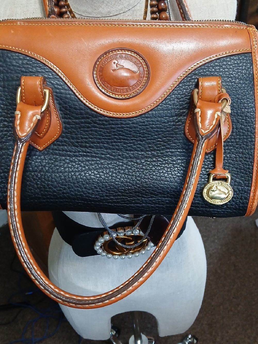 Dooney & Bourke Black and Tan Pebbled Leather Satchel